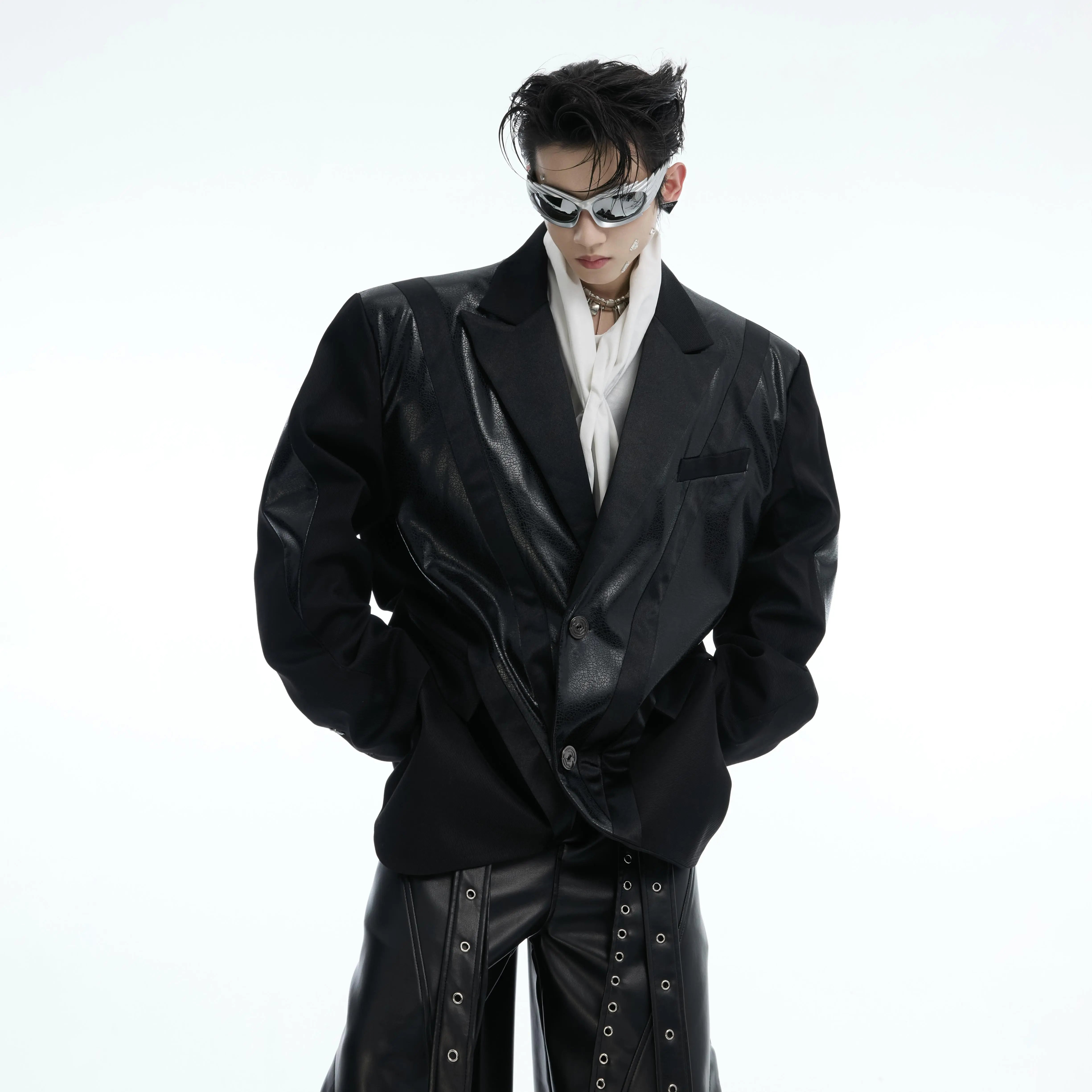Deconstructed PU leather oversized blazer with padded shoulder detail, showcasing streetwear fashion