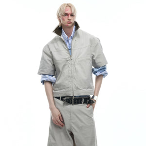 Close-up of premium PU leather collar on deconstructed short-sleeve jacket with retro streetwear vibes