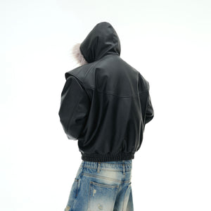 Close-up of the metallic foil logo on the premium PU leather jacket with edgy streetwear aesthetic