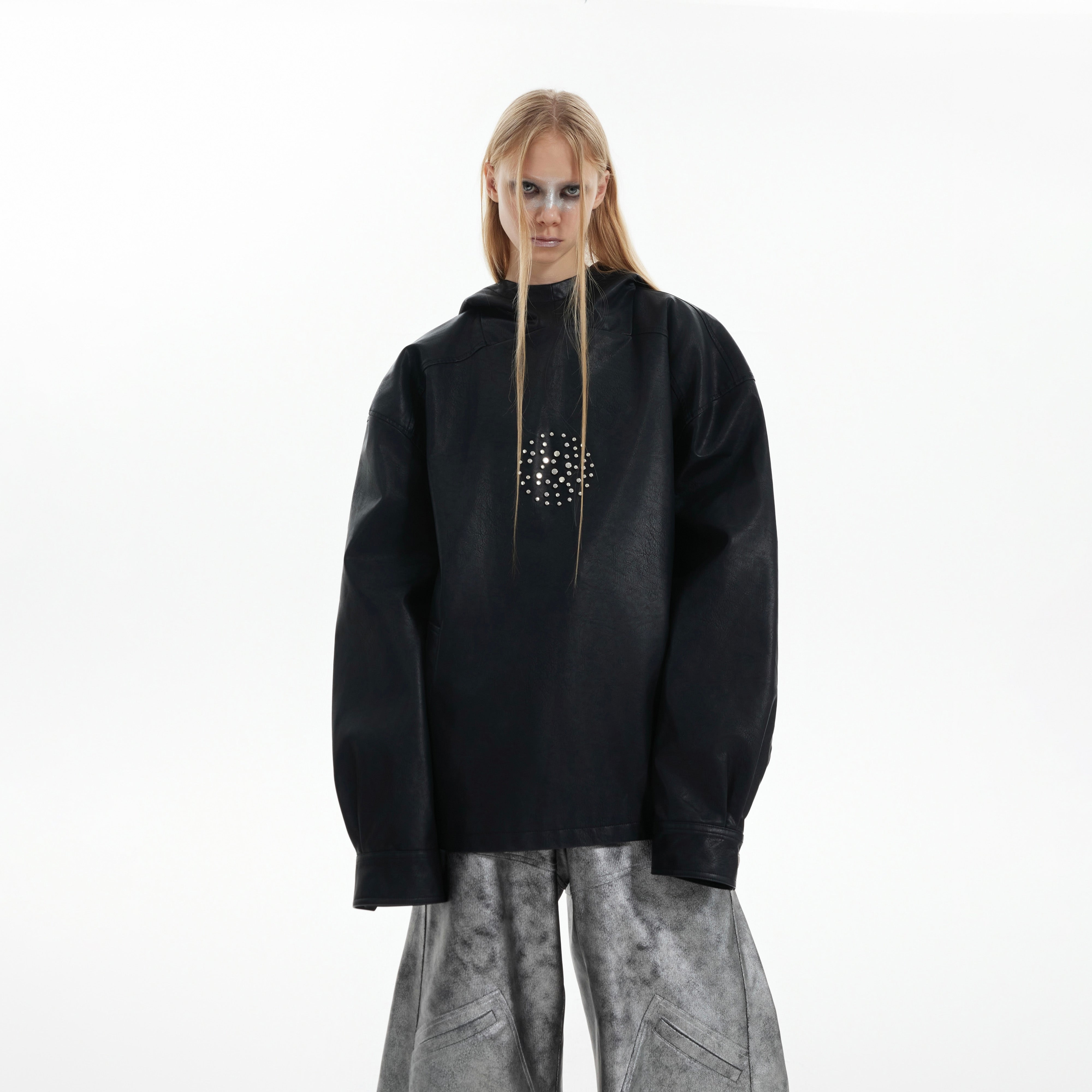 Front view of dark punk hooded jacket showing signature linework design and distressed details