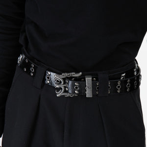 Side view of hip-hop style belt featuring prominent studded details and punk logo design