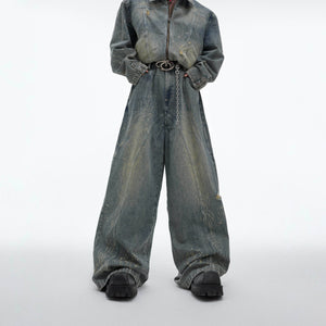 Layflat view of deconstructed denim jacket and jeans set with raw edges and punk rock attitude