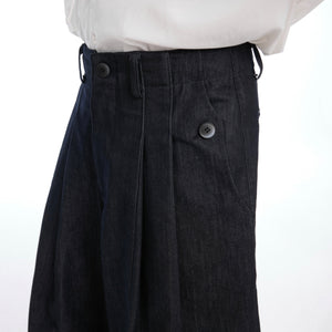 Close-up of heavyweight cotton blend fabric showing premium denim texture and quality stitching