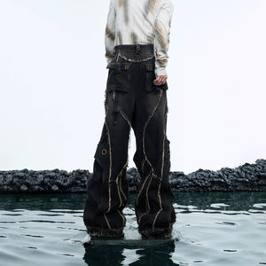 Back view of double-layer distressed jeans featuring the unique raw hem detailing and loose fit