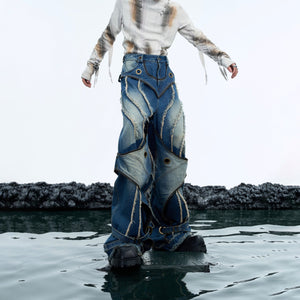 Side profile of distressed retro jeans highlighting the double-layer construction and raw hem design