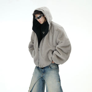 Couple modeling reversible fox hoodie demonstrating both cotton and fleece sides