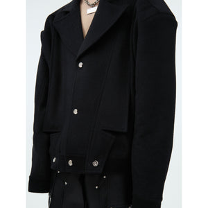 Side profile of street-ready wool blazer featuring short cut design and contemporary oversized fit