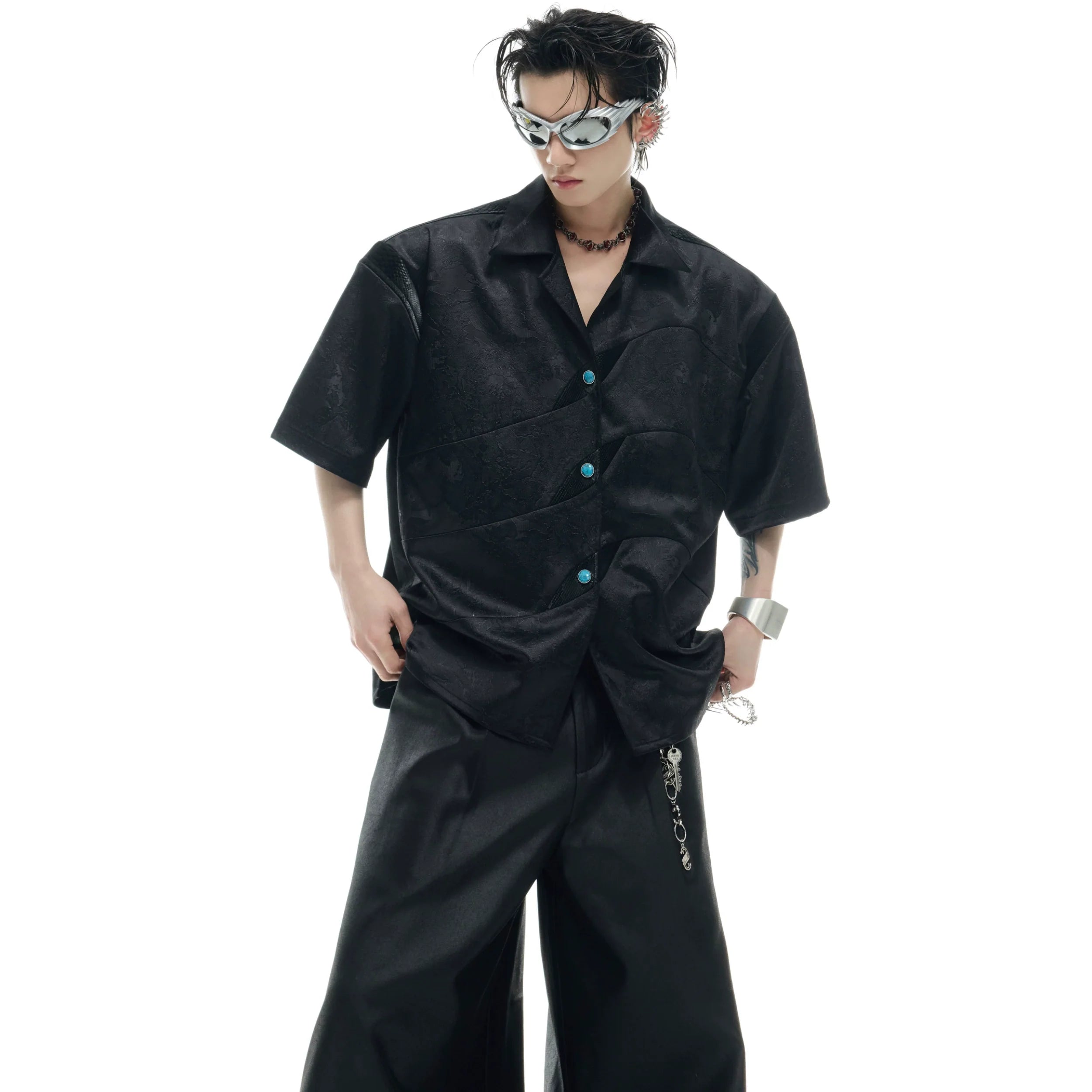 Deconstructed short-sleeve shirt featuring unique turquoise patchwork with textured mesh relief pattern detail