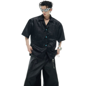 Deconstructed short-sleeve shirt featuring unique turquoise patchwork with textured mesh relief pattern detail