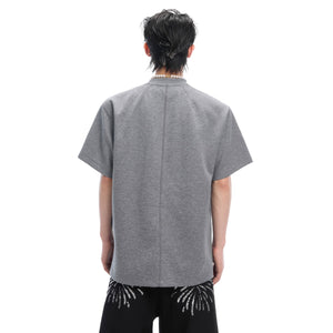 Model wearing oversized basic tee showcasing ultra-soft natural protein cotton fabric blend