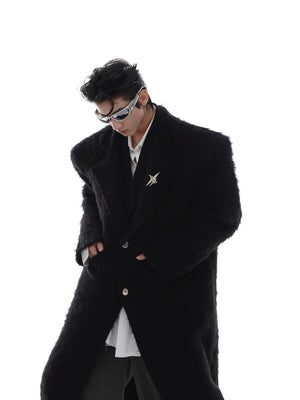 Closeup of premium faux mink and wool blend fabric on avant-garde trench coat with structured shoulders