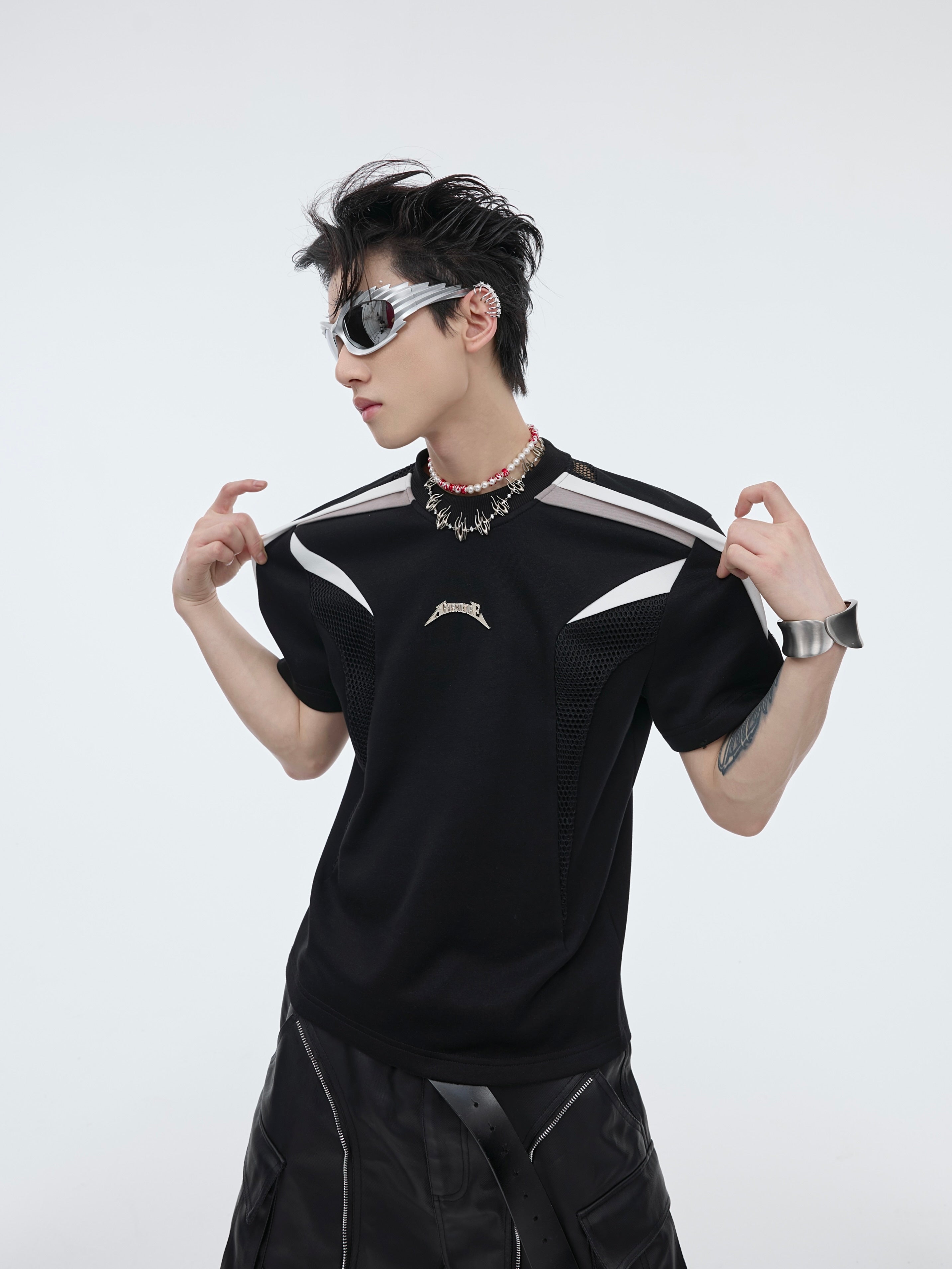 Slim-fit deconstructed t-shirt with raw hem detailing and gender-neutral streetwear aesthetic