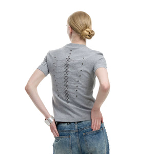 Front view of snake eye spine metal rivet slim fit tee showing intricate embroidery and beadwork details