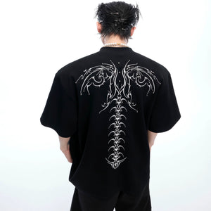 Men's oversized streetwear tee featuring bold snake eye spine embroidery design with 3D detailing