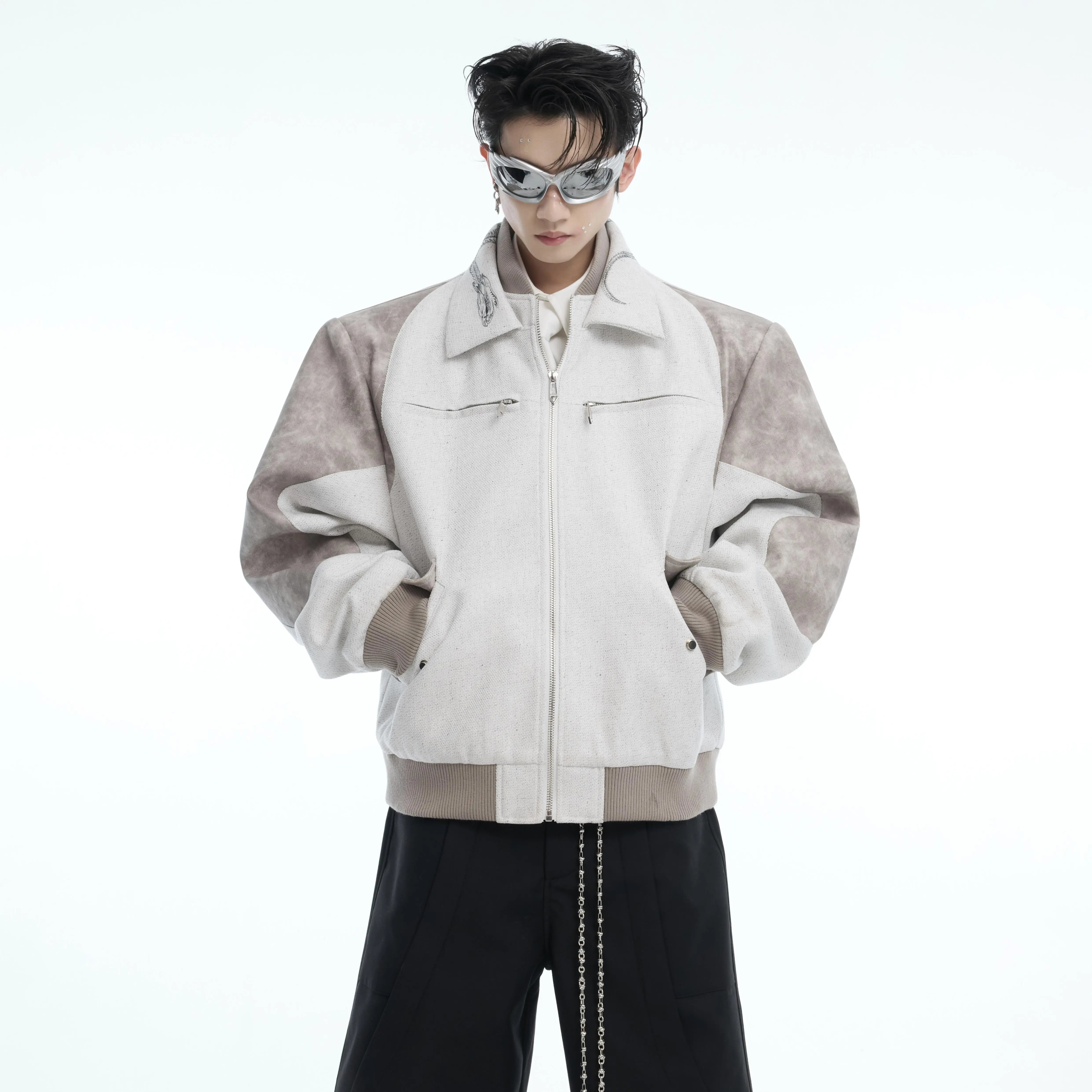 Front view of snake print patchwork cropped jacket featuring edgy double collar design for streetwear fashion