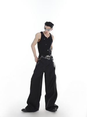 Detailed close-up of asymmetrical metallic buttons on snake print vest with architectural precision