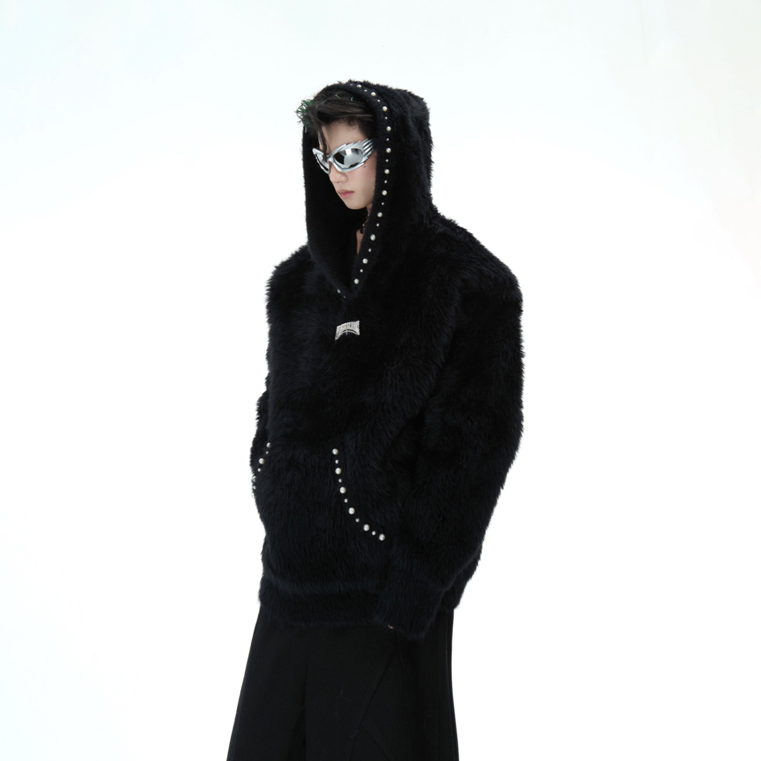 Side angle showing the cozy oversized fit and premium quality of this pearl-trimmed hooded sweater