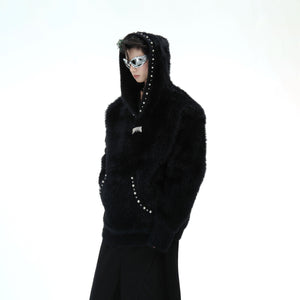 Side angle showing the cozy oversized fit and premium quality of this pearl-trimmed hooded sweater