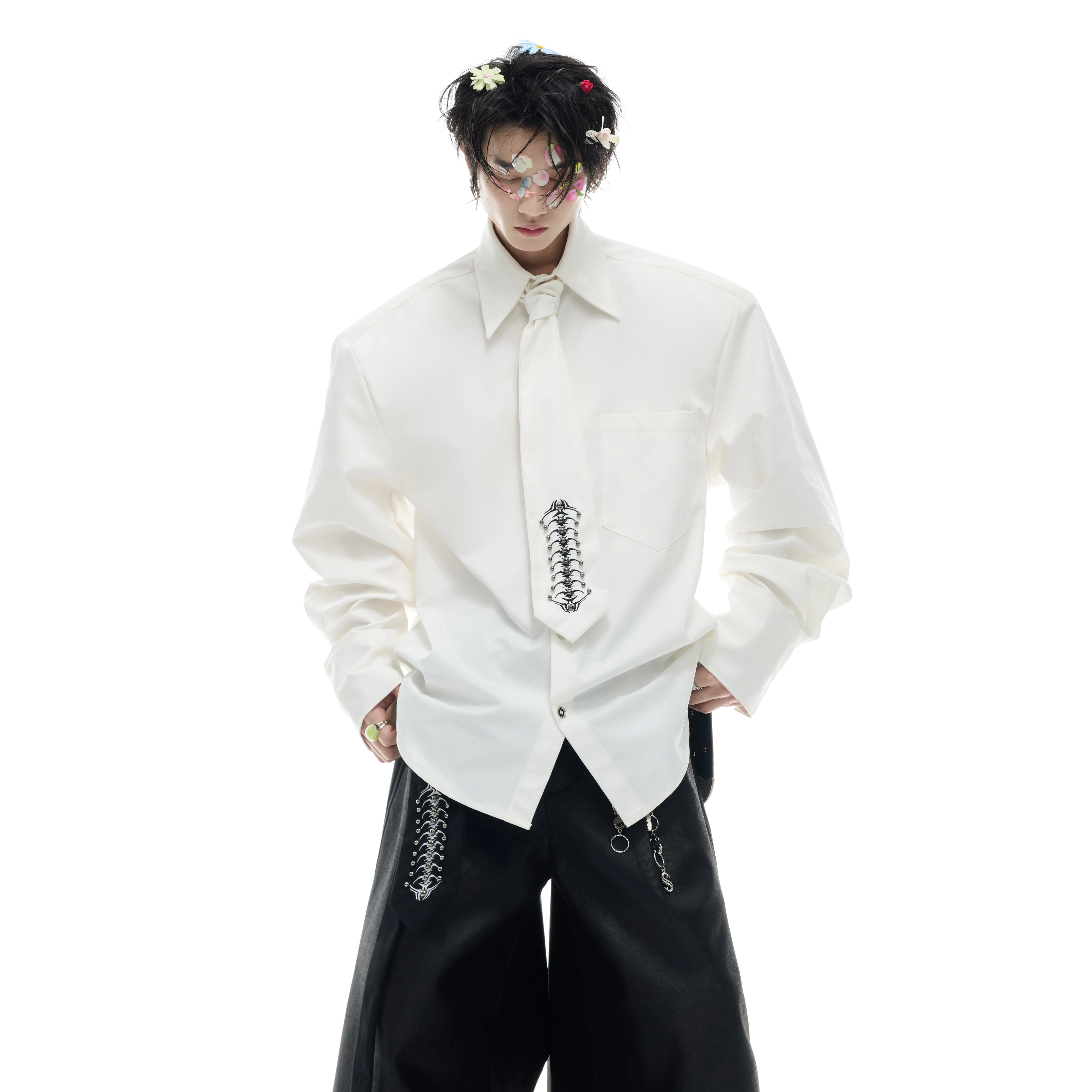 Close-up of unique spinal bone embroidery on deconstructed long-sleeve shirt showing intricate details