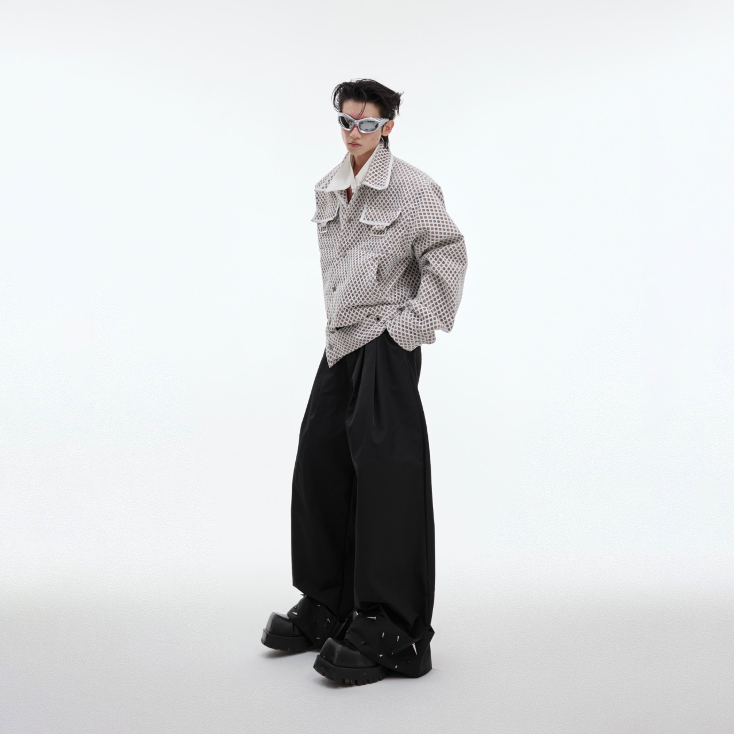 Deconstructed split-panel leather jacket showing avant-garde streetwear design details