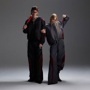 Side angle showcasing the sporty yet high-fashion details of this avant-garde streetwear outfit