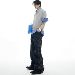 Close-up detail of premium denim fabric showing quality stitching and distressed vintage wash