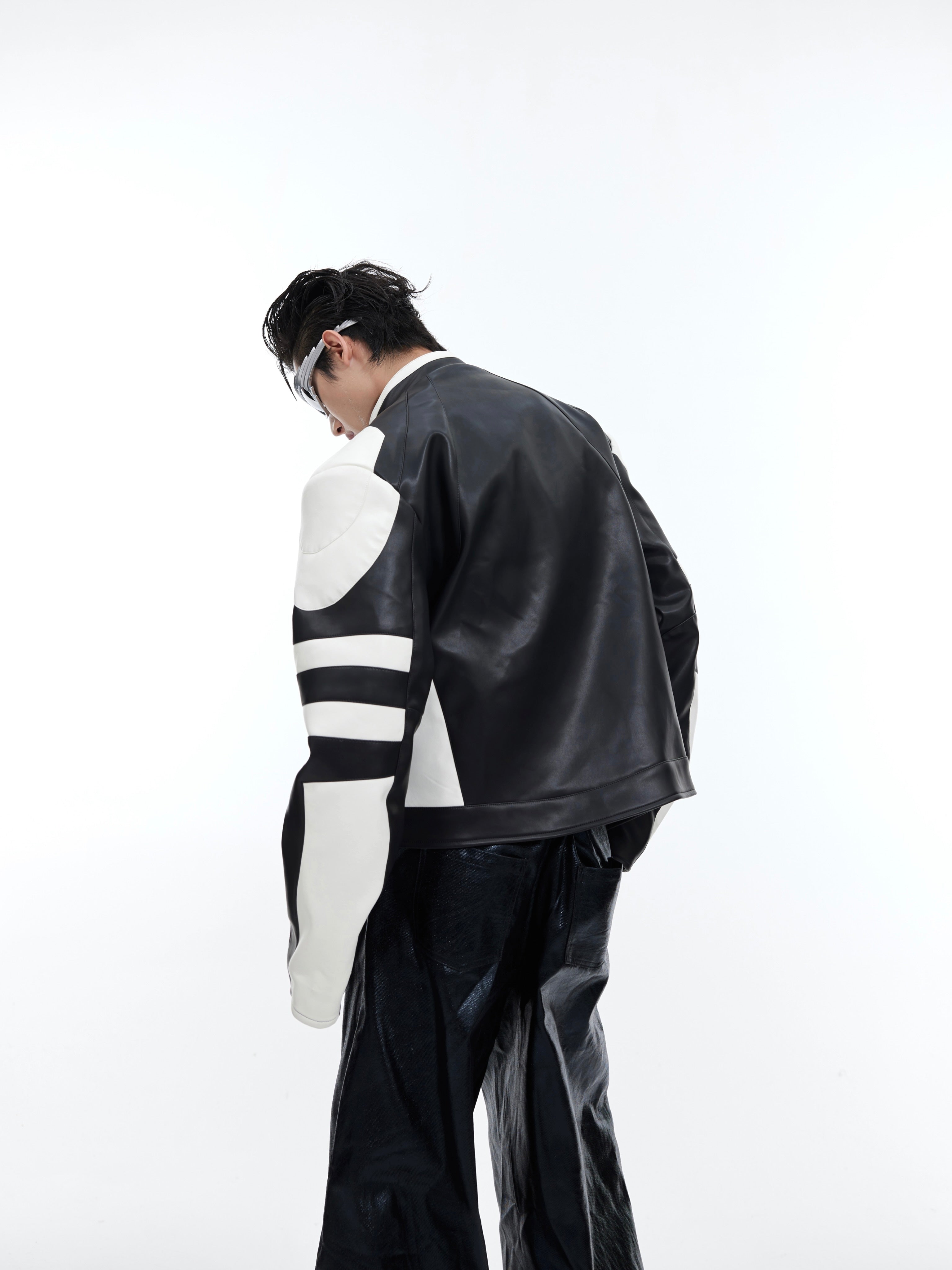 Back view of cropped biker jacket featuring reconstructed vintage look with oversized streetwear fit