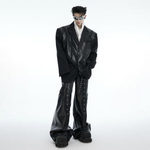 Close-up view of the textured PU leather material and construction details on the oversized blazer