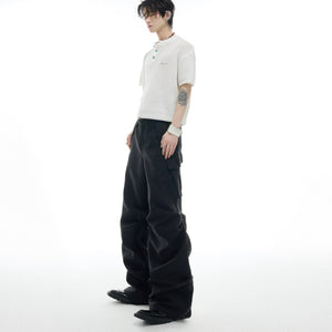 Full-length view showcasing the oversized silhouette of these trendy pleated cargo pants