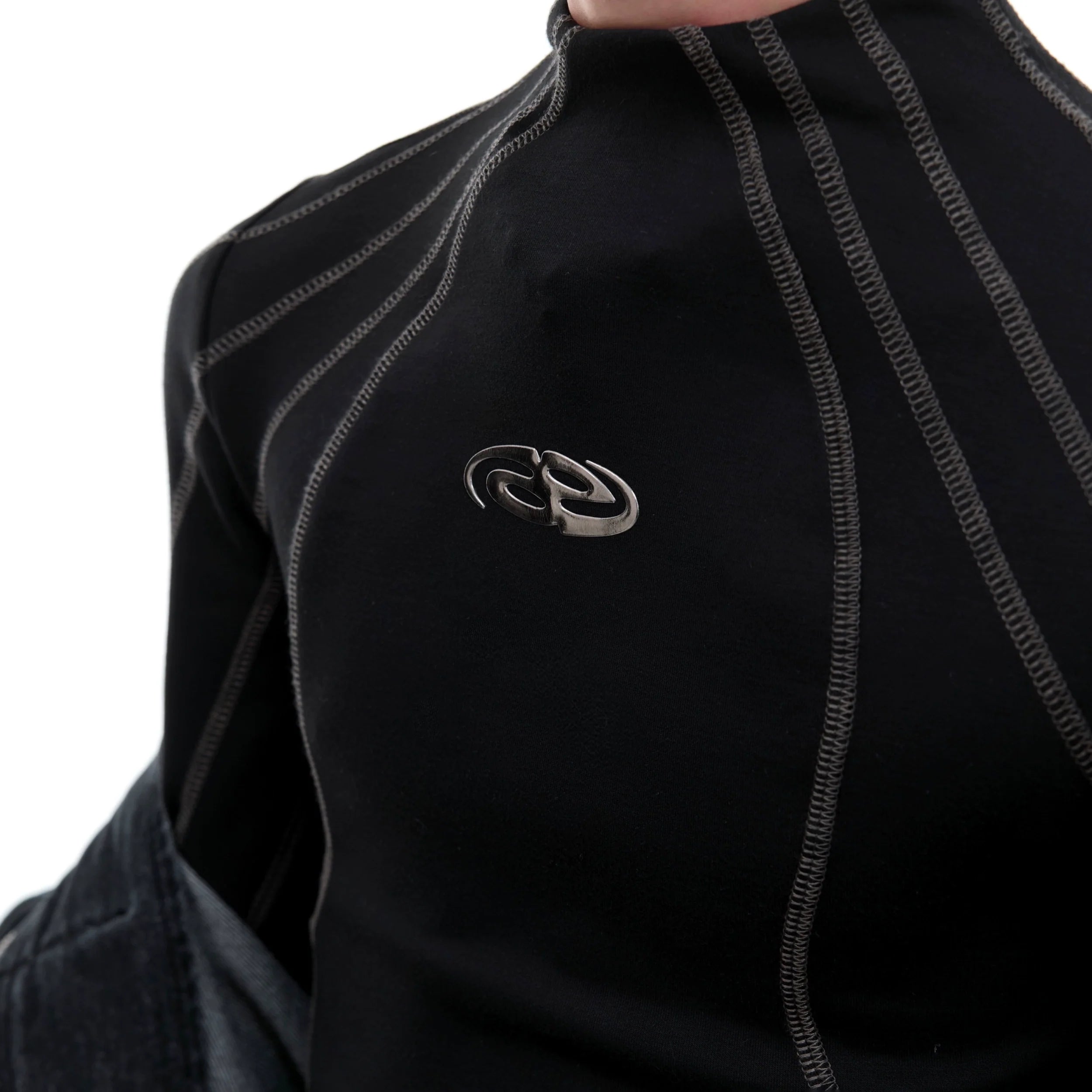 Streetwear cropped long sleeve t-shirt with metallic trim mock neck, featuring asymmetric cuts and bold paneling