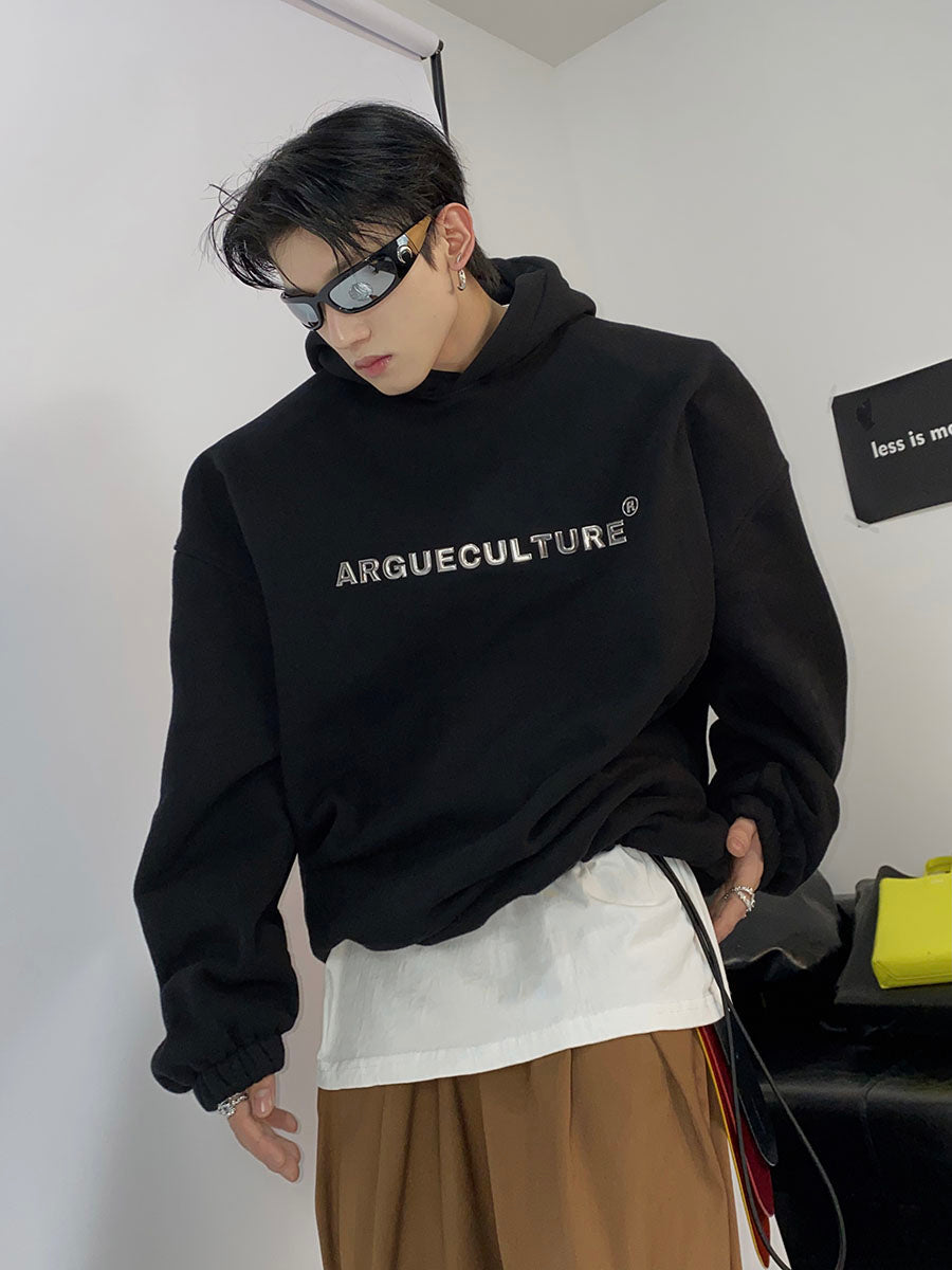 Streetwear hoodie with metallic print and structured shoulder pads, featuring fleece lining for warmth and comfort