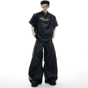 Fashion model wearing oversized deconstructed V-neck tee with urban streetwear styling