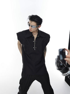 Side view displaying structured shoulder pads and asymmetrical design of fashion-forward deconstructed top