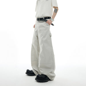 Detailed view of metal stud embellishments on cargo pants from the urban streetwear set