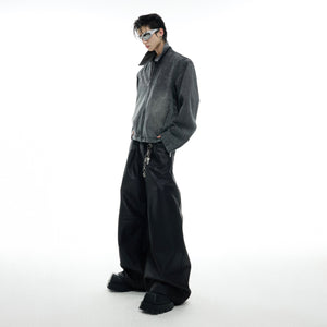 Model wearing vintage studded denim jacket with skeleton embroidery, showcasing the short box fit silhouette