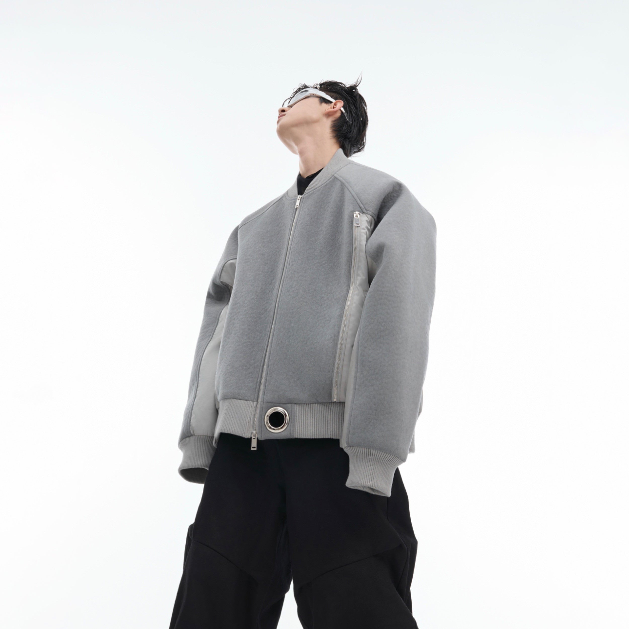 Oversized suede bomber jacket with deconstructed design, perfect for urban streetwear fashion