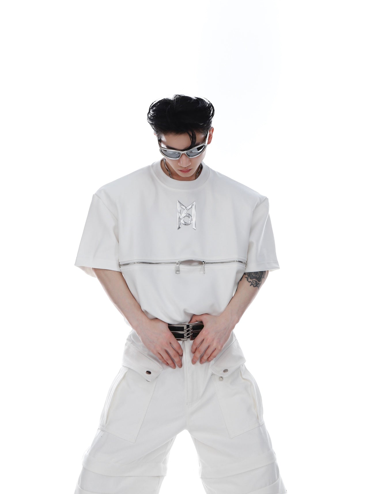 Front view of oversized streetwear zip-up tee featuring controversial asymmetric lines and bold graphic print