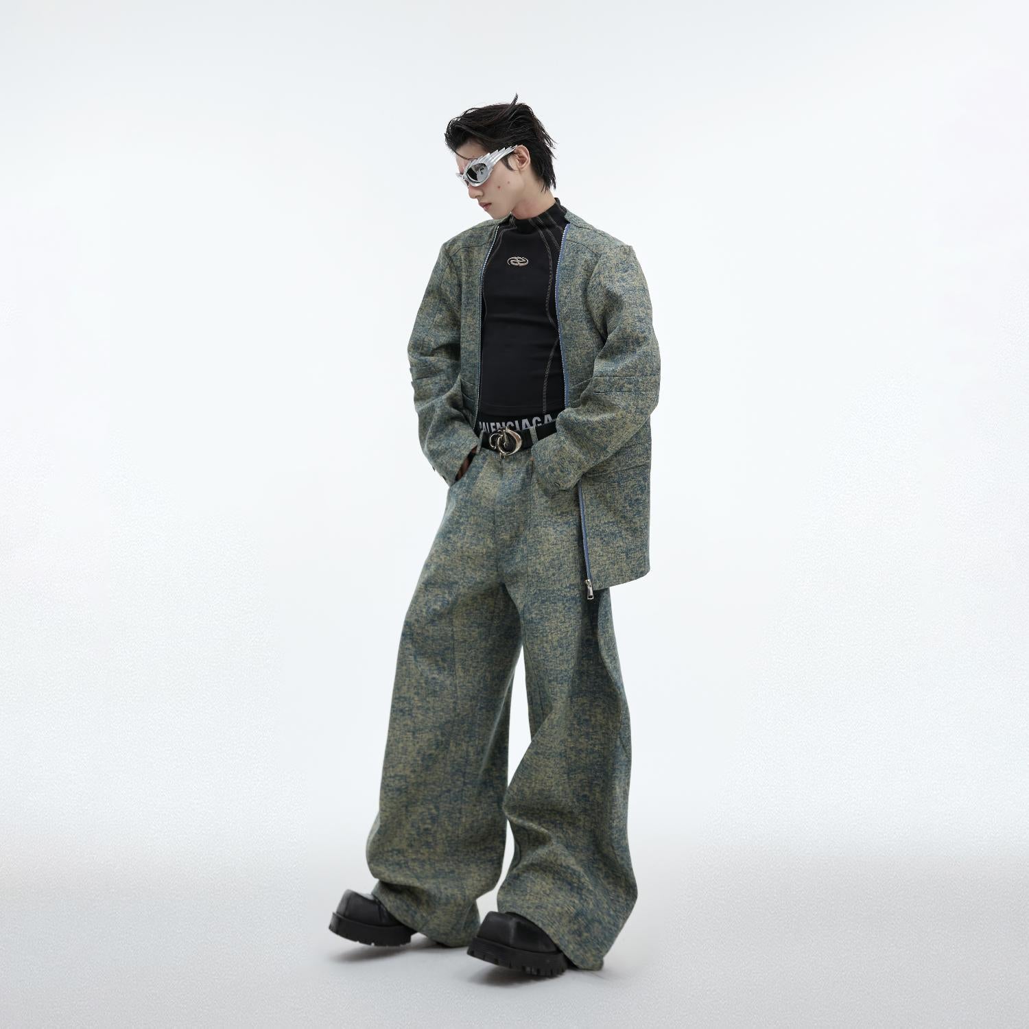 Front view of deconstructed denim jacket with metal zipper detailing and raw edges for edgy streetwear look