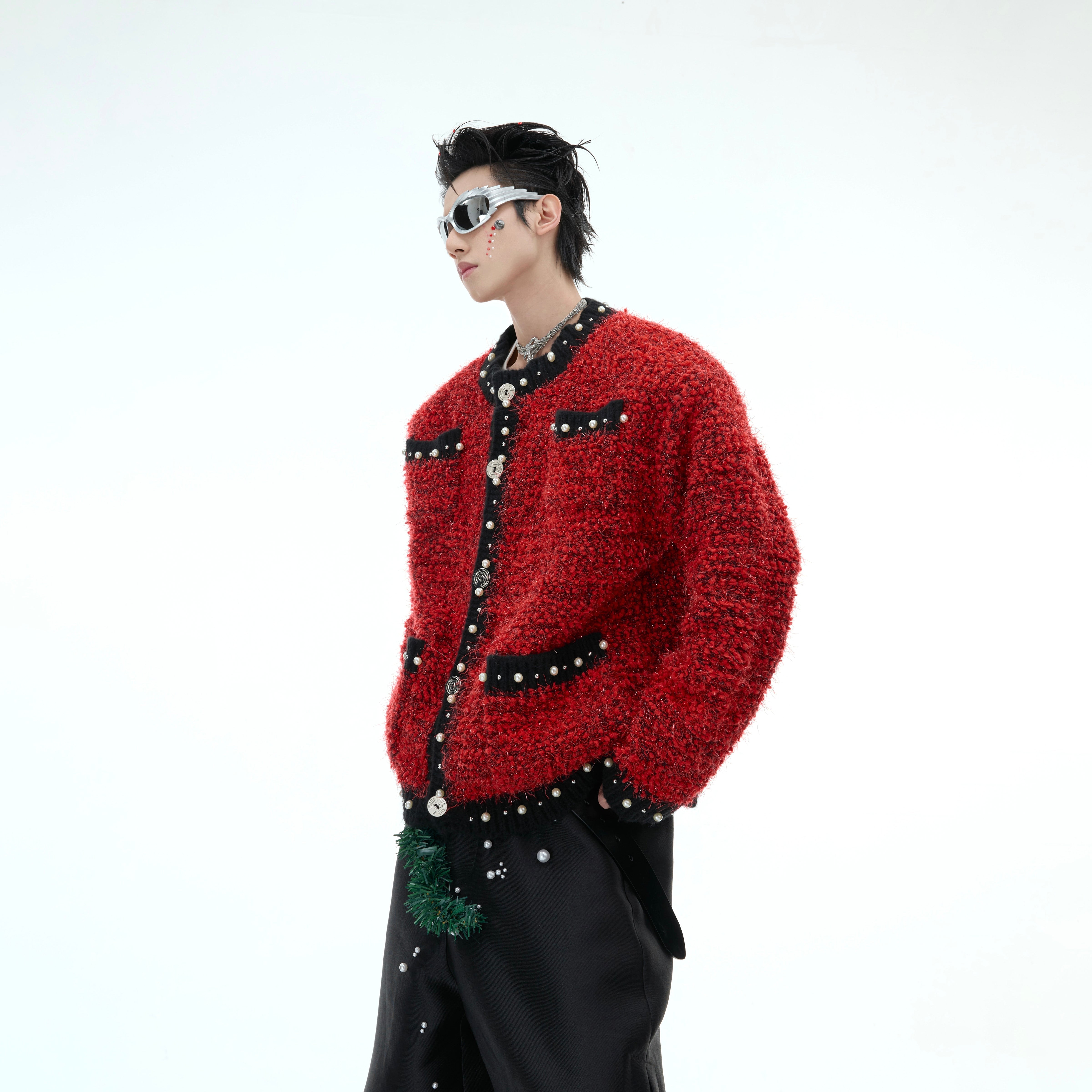 Close-up of Chanel-inspired tweed jacket with baroque pearl accents and contrast piping trim