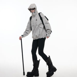 Close-up demonstration showing how to remove the thermal lining from the waterproof urban hiking jacket