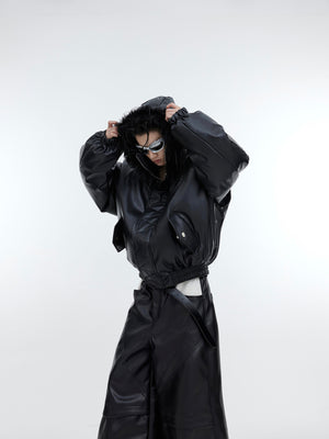 Side angle showing unique deconstructed draping and metal-accented zipper sleeves of this statement puffer coat