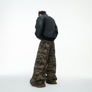 Side profile view of vintage camo cargo pants highlighting the deconstructed waist and wide-leg cut