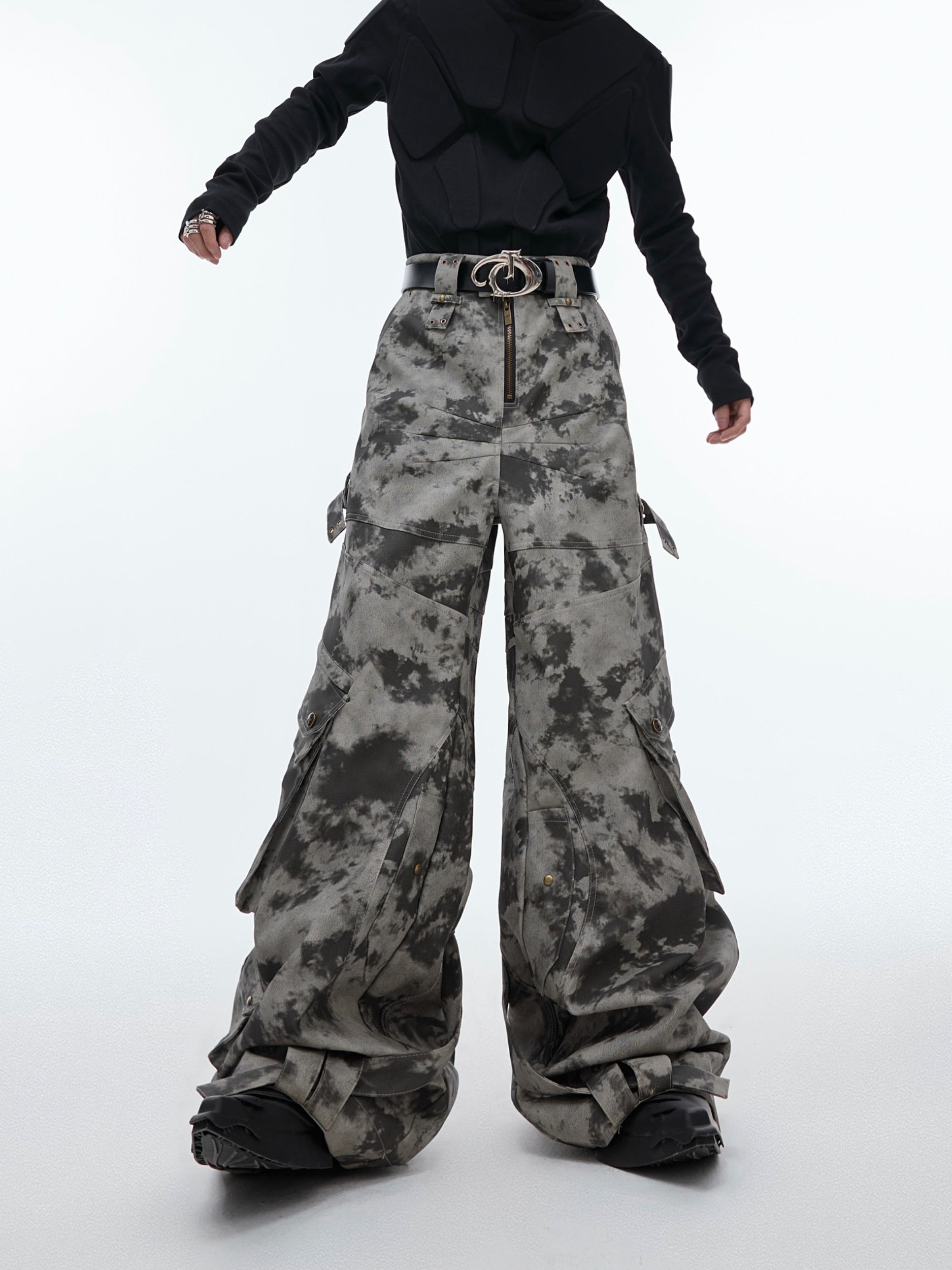 Distressed vintage leather cargo pants with wide legs and metal buttons, featuring a washed finish for urban streetwear style