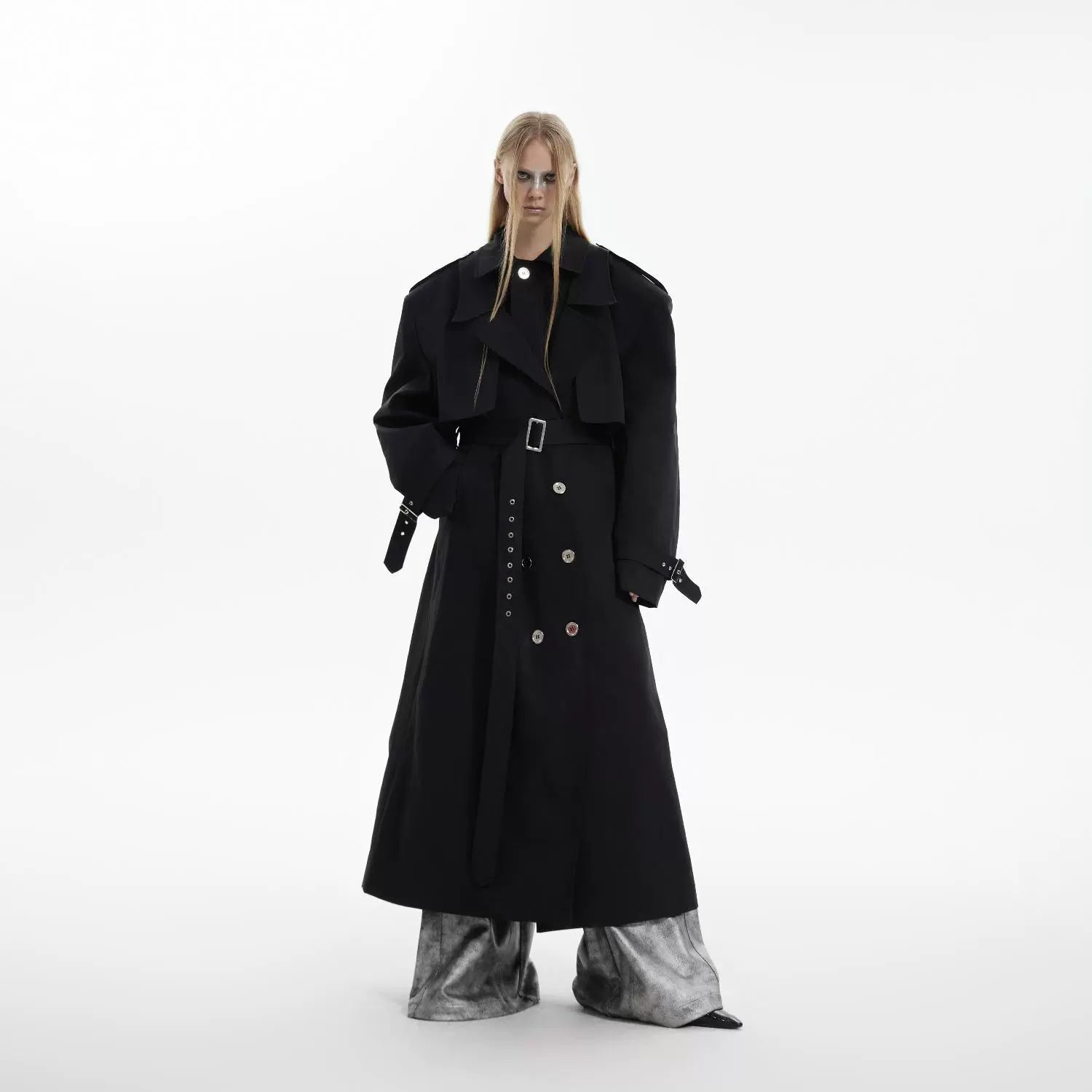 Front view of vintage deconstructed trench coat with statement-making shoulder pads and double-breasted design