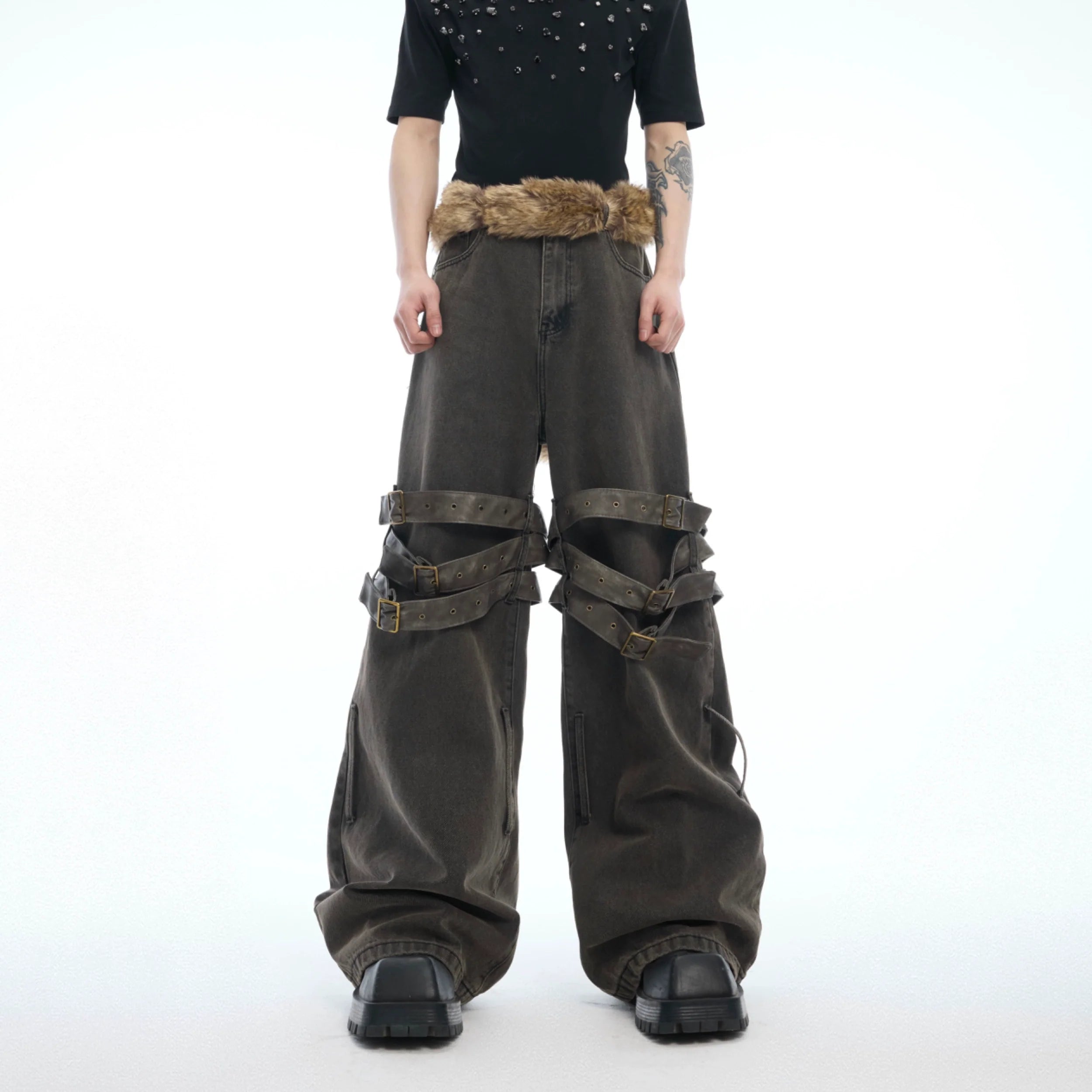 Vintage distressed bell-bottom jeans featuring removable heavyweight belt design with flare leg opening