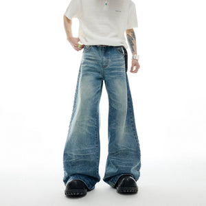 Vintage distressed straight-flare jeans with metal stud details and authentic wear patterns for retro street style