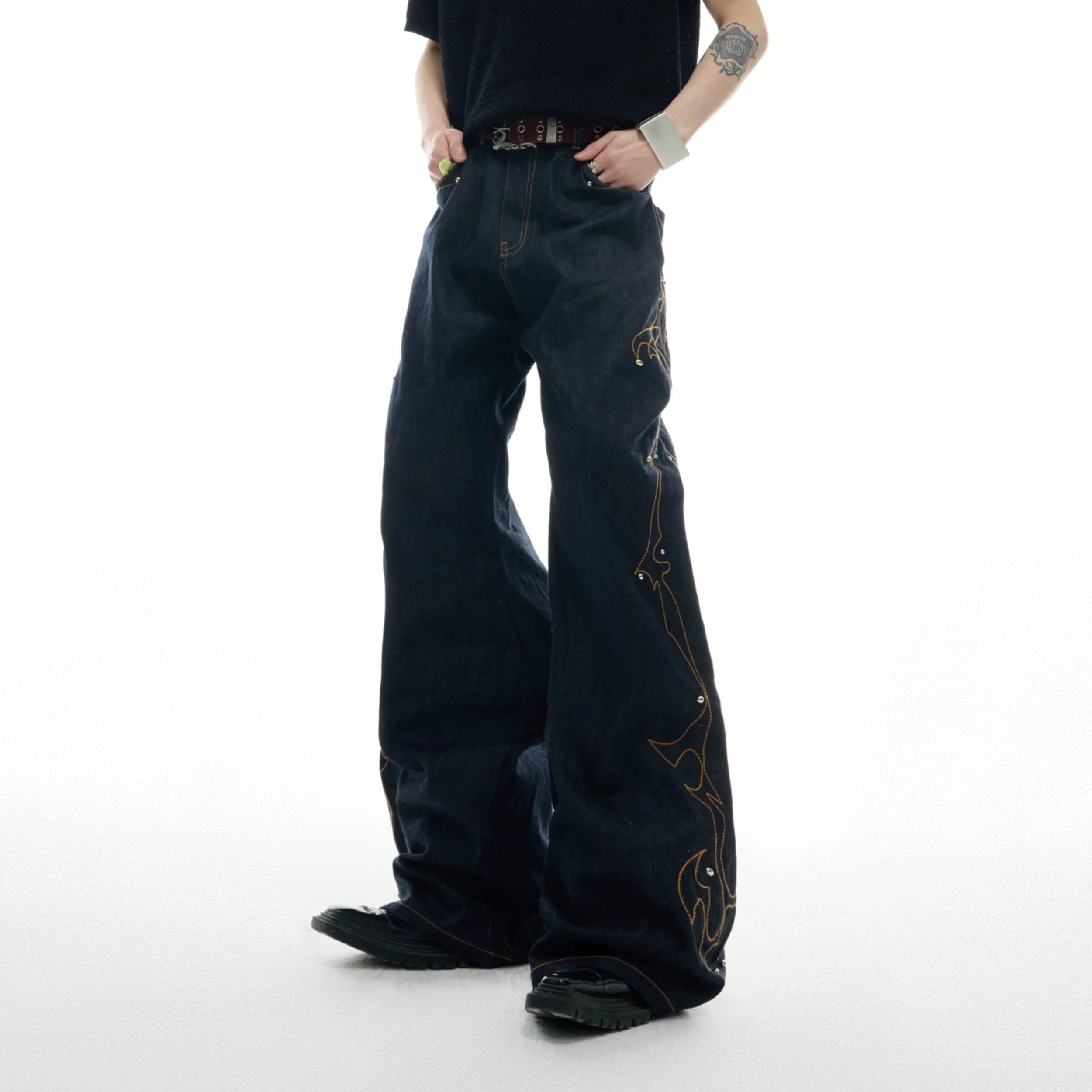 Front view of vintage straight-flare jeans with distinctive red stitching details, showcasing the A-line silhouette