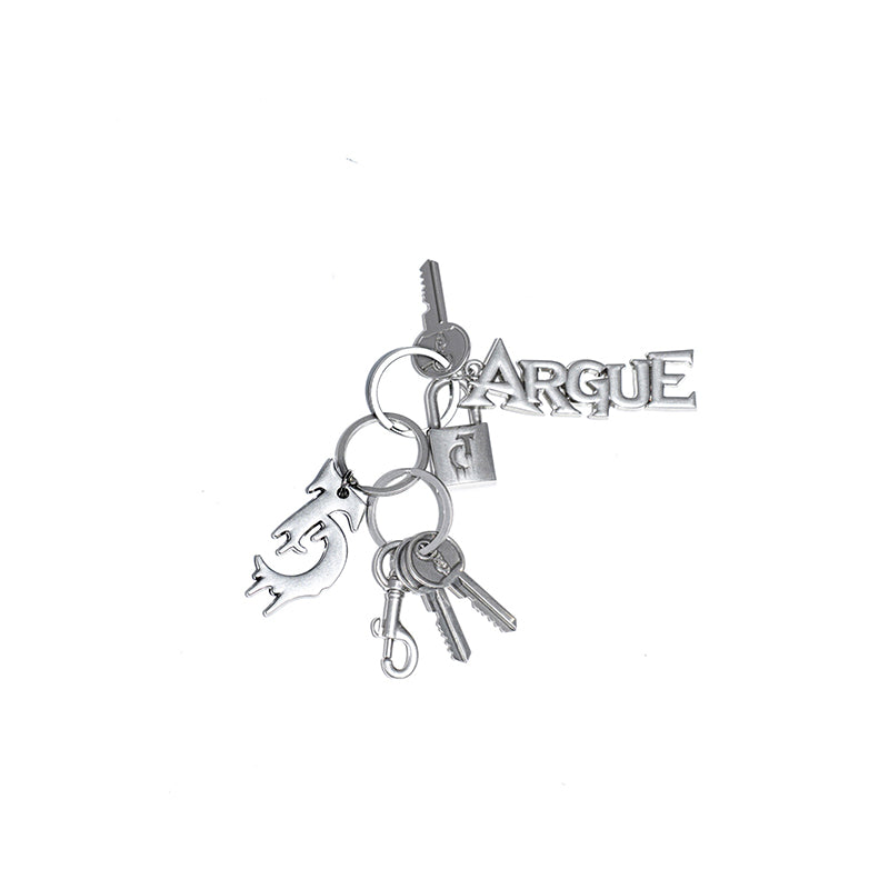 Close-up of vintage metal buckle keychain with distressed logo, showcasing retro industrial design and durable alloy construction