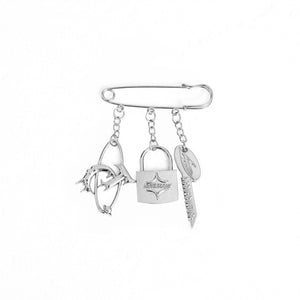 Close-up of vintage metal logo pin showing premium polished finish and retro design details