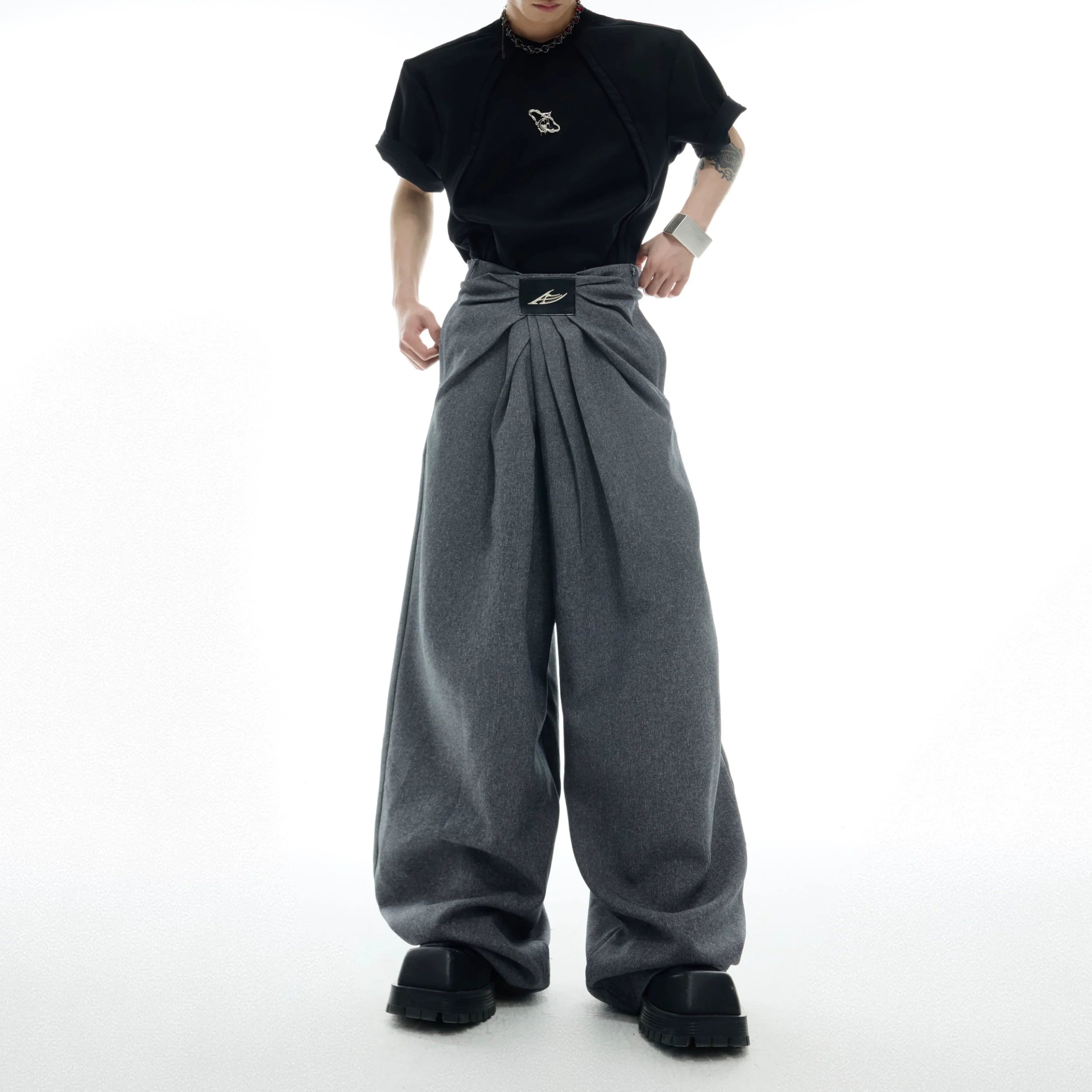 Vintage French pleat wide-leg trousers featuring a signature angular waistband, perfect for streetwear outfits